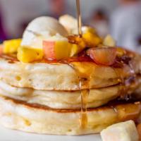 Flapjacks · our buttermilk batter. warm syrup.  diced fruit. whipped butter.