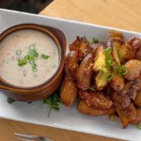 Smashed Fries & Bacon Gravy · fingerling potatoes fried to crispy perfection. house bacon gravy.