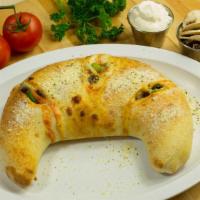 Veggie Calzone · Mushrooms, bell peppers, onions, tomatoes, black olives, ricotta & mozarella