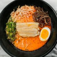 Spicy Sesame Ramen · 24 hours boiled pork and chicken broth with homemade spicy sesame sauce topping with bean sp...