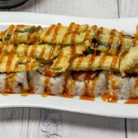 Okie Dokie Roll · In: Salmon, Cream Cheese, Avocado 
Out: Fried Jalapeno with Eel Sauce