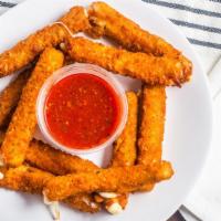 Mozzarella Sticks · 8 breaded Mozzarella sticks deep fried and served with a side of meat sauce.