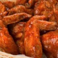 Buffalo Wings · Fried wings smothered in our own spicy buffalo sauce. Served with ranch dressing and celery ...
