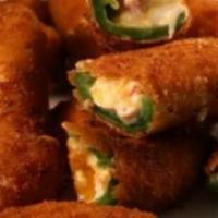Jalapeño Poppers · 8 jalapeño peppers filled with cheese, breaded and deep fried. Served with ranch dressing.