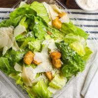 Caesar Salad · Crisp romaine leaves tossed with Parmesan cheese. Topped with garlic-herb croutons.