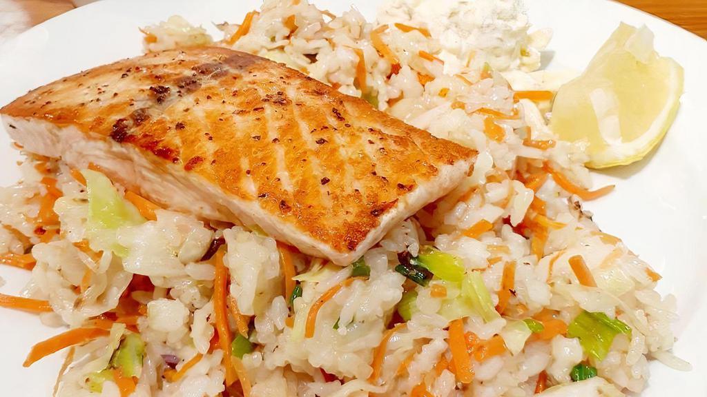 Grilled Salmon W/ Vegetable Fried Rice · Fillet seasoned with lemon pepper, served on a bed of vegetable fried rice served with macaroni salad.