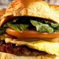 Portuguese Sausage Sliders · Homemade Portuguese sausage, grilled onions, fried egg, lettuce, tomatoes, and mayonnaise on...
