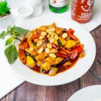 Kung Pao Beef · Stir-fried beef, zucchini, onions, bell peppers, chili peppers in spicy sauce, topped with p...
