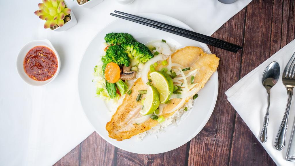 Lemon Grilled Fish  · Lightly pan-seared white fish in a lemon pepper seasoning, served with steamed veggies and rice