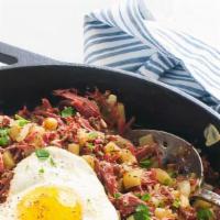 Corned Beef Hash And Egg  · Birdnest style with over easy egg