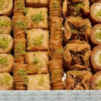 Baklava Bites · Various layered pastry desserts are made of filo pastry, filled with chopped nuts, and sweet...