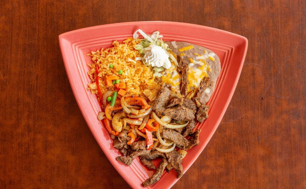 Steak Fajita/ Carne De Res Fajita · Strips of angus beef and seasoned on the grill with onions, tomatoes, and bell peppers.