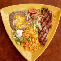New York Steak / Carne Asada · 10 oz. grilled with our special seasoning, served with vegetables. (Avocado, cactus, and oni...