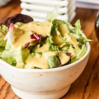 House Salad · Spring mix salad with house miso salad dressing.