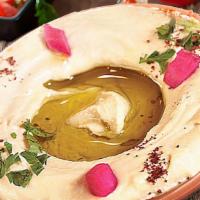 Hummus · Vegan. A delicious middle Eastern blend of garbanzo, beans tahini, fresh garlic, lemon & oli...