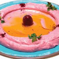 Pink Beets Hummus · Vegan. A delicious middle Eastern blend of garbanzo, beans tahini and fresh beets, fresh gar...