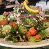 Greek Salad · Healthy food. Hearts of romaine lettuce, tomatoes, cucumbers, onions, topped with feta chees...