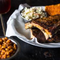 Full Rack Baby Back Ribs · Hickory smoked baby back ribs lightly glazed with our famous TBG BBQ Sauce.