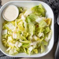 Caesar Salad · Romaine lettuce with shaved parmesan, croutons and caesar dressing.