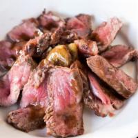 New York Steak Tagliata (12Oz) · Sliced prime steak served with rosemary roasted potatoes in a balsamic reduction.