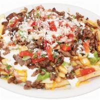 Carne Asada Fries ( Large ) · topped with cheese,guacamole,sour cream and pico de gallo.
