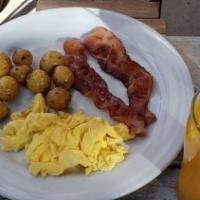 Simple Breakfast · Two eggs (cage-free natural eggs), two bacons (applewood), roasted baby potato served with w...