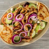 Greek Salad · Salad with cucumbers, tomato, purple onion, bell pepper, feta cheese and a side of pita bread