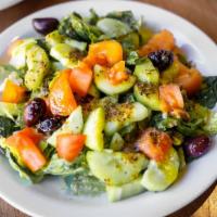 Green Salad - Small · Chopped spring greens, tomatoes, cucumbers, Kalamata olives, and topped off with our house d...