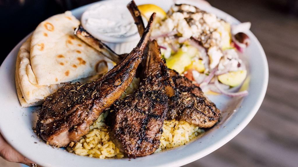 Lamb Chop Plate · Three frenched lamb chops seasoned generously with Greek seasoning and a hint of rosemary, cooked over open flame, served with rice pilaf or french fries with Greek salad, tzatziki sauce or Greek yogurt and pita bread.