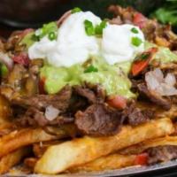 Carne Asada Fries · French fries topped with beans, cheese, guacamole, pico de gallo , sour cream and jalapenos
