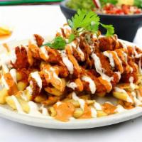 Fiesta Buffalo Fries · French fries topped with delicious spicy buffalo chicken tenders, chipotle sauce and ranch d...