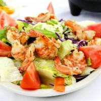 Shrimp Salad · Includes mixed greens, carrots, cucumber, zucchini, cheese, tomatoes, and avocado.