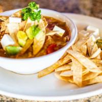 Chicken Tortilla Soup · Served with vegetables, tortilla strips, avocado and cheese