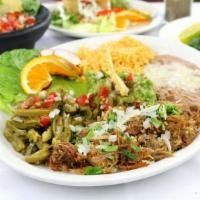 Carnitas · Lean pork marinated with fresh oranges and spices. Slowly cooked in its own juices until ten...