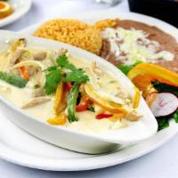 Camarones Con Rajas Y Crema · Seven jumbo shrimp sauteed with mushrooms, onions and bell peppers in a cream sauce. Served ...