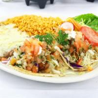 Baja Fish Tacos Combo · Breaded or grilled sea bass fish tacos topped with cabbage, sour cream, chipotle sauce, and ...