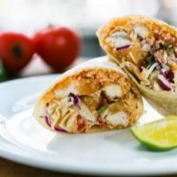 Burrito De Pescado · Fish burrito with your choice of grilled fish, or breaded fish, rice, cabbage, tomatoes, pic...