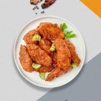 Chi Chi Chipotle Wings · Fresh chicken wings breaded, fried until golden brown, and tossed in chipotle sauce. Served ...