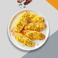 Go Go Cheese Garlic Bread · (Vegetarian) Housemade bread toasted and garnished with butter, garlic, mozzarella cheese, a...