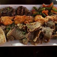 Coach'S Mixed Grill · Chicken Shish Kebab on a skewer,  Gyro and Kofte. Served  with grilled tomatoes.
