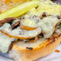 Philly Cheese Steak · Grilled thin sliced steak on a roll with sauteed bell peppers, onions and jack cheese.
