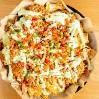 Chicken Nachos · Home-made corn tortilla chips, cheddar cheese, habanero jack cheese, shredded Mexican chicke...