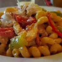 Cajun Chicken Pasta · Diced chicken breast, bell peppers, and shallots in a Cajun-spiced cream sauce.