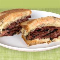 Pastrami Reuben · Dry aged pastrami with sauerkraut, Russian dressing and Swiss cheese on your choice of bagel.