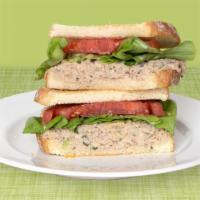 Tuna Salad · Tuna salad with  lettuce and freshly sliced tomato on your choice of bagel.