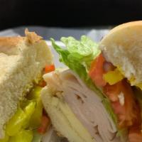 Ham Sub Sandwich · HAM, AMERICAN CHEESE, LETTUCE, PICKLES, RED ONIONS, TOMATOES AND MAYO ON A HOAGIE ROLL.  COM...