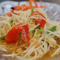 Papaya Salad Deluxe · Hot. Julienne green papaya, string beans, tomatoes and roasted peanuts mixed with spicy lime...