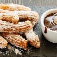 Churros · Fried pastry dusted with cinnamon sugar.
