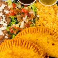 Empanadas Platter · Two crispy fried dough filled with your choice of meat and cheese.