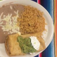 Chimichanga Meal · Deep fried burrito with meat and cheese. Topped with sour cream and guacamole. Served with b...